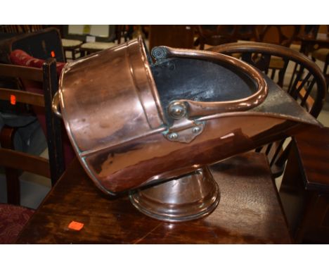 A copper coal helmet, approx. length 40cm