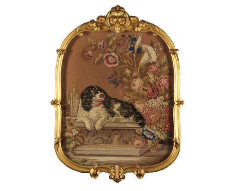 A VICTORIAN GILTWOOD AND BERLIN WOOLWORK FIRESCREEN, C1860&nbsp;&nbsp; the leafy scrolling carved frame enclosing a raised wo
