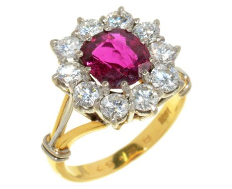 A RUBY AND DIAMOND RING&nbsp;the oval ruby 1.9ct approx, the brilliant cut diamonds 2ct approx, in gold marked 18ct, 8g, size