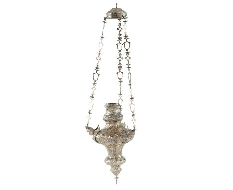 A PORTUGUESE ROCOCO SILVER SANCTUARY LAMP&nbsp; of richly chased ogee form with three full relief cherub's heads, suspended f