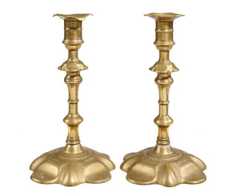 A PAIR OF ENGLISH BRASS CANDLESTICKS, MID 18TH C&nbsp; with knopped stem and petal foot, 20.5cm h  Good condition with light 