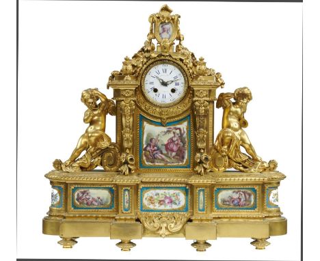 A FRENCH ORMOLU MOUNTED CLOCK RAINGO FRES A PARIS, C1880 with enamel dial and bell striking movement, the case flanked by put