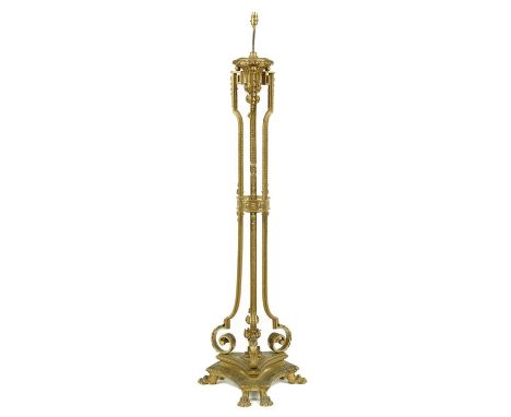 A NEO CLASSICAL STYLE GILT BRASS STANDARD LAMP, EARLY 20TH C&nbsp; on six paw feet, 144cm h excluding later fitment  Much dir