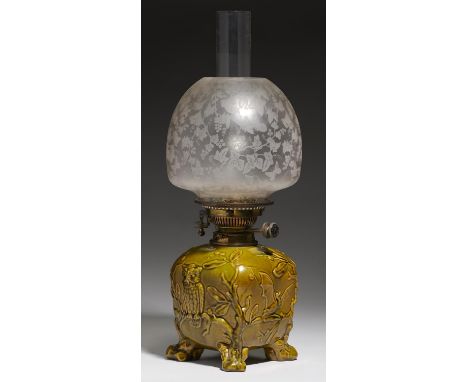A WEDGWOOD OLIVE MAJOLICA OWLS AND BATS OIL LAMP, C1880&nbsp; on four rustic feet, Hinks Patent brass burner marked for Maple