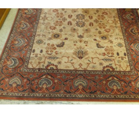 A modern machine made "Super Taj" Persian design carpet, the central cream ground with all-over floral and foliate decoration