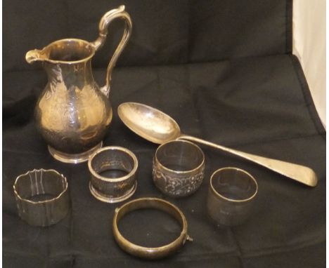 A collection of silver items to include silver baluster shaped jug with etched decoration, four various silver napkin rings, 