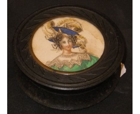 A 19th Century circular snuff box, the top inset with portrait of a lady wearing a feathered hat