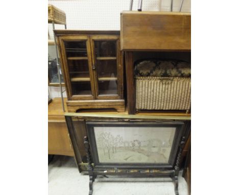 A teak sideboard, an oak display cabinet of small proportions with two glazed doors enclosing three shelves, raised on bracke