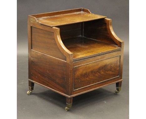 An 18th Century mahogany commode with three quarter galleried lift up top above lift top seat, flamed mahogany front, raised 