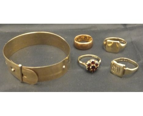 A 9 carat gold and engraved adjustable bracelet, 9 carat gold wedding band, two 9 carat gold signet rings and a 9 carat gold 