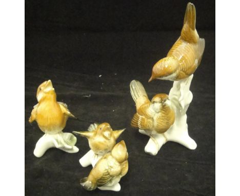 A Karl Ens porcelain figure group of two birds on a branch, together with two similar depicting baby birds on branches (3) CO