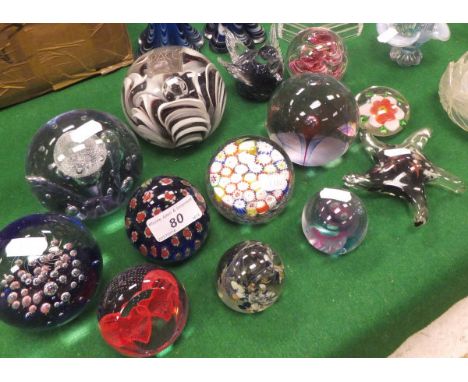 A collection of glass paperweights to include Caithness "Love Hearts", Caithness "Twirl", etc (13)