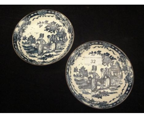A pair of 18th Century Worcester saucers, transfer decorated in underglaze blue with "The Milkmaid" pattern (circa 1770) COND