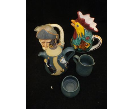 A crate containing a collection of miscellaneous china wares to include an art pottery teapot, jug and sugar bowl relief deco