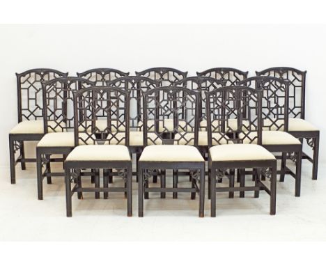 A set of 12 Chippendale style dining chairs W50cm, H91cm, ebonized beechwood, with drop in seats upholstered in cream fabric.