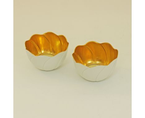 A pair of Meissen water lilies / eggshell porcelain candle holders with a gilded interior and glass insert for a tea light, d
