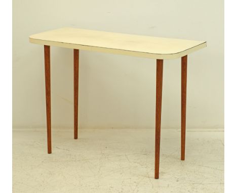 An ivory Formica top console table on four round beechwood tapering legs, measuring 101x45cm, H75cm, mid century.