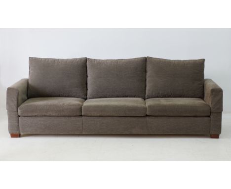 A three seater sofa by Pambos Savvides, loose cushions upholstered in grey velvet. W250cm, D84cm, H90cm. c1970-80s.