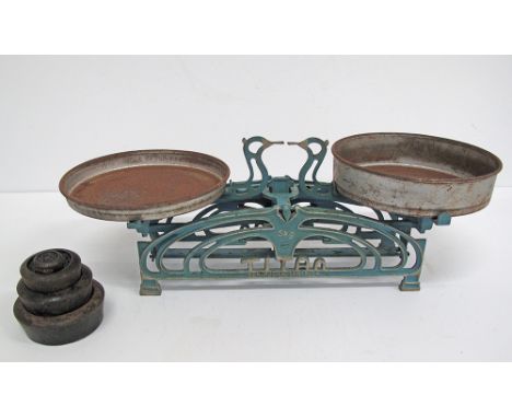A vintage TITAN weight scales for the kitchen, in cast iron and original blue enamel paint highlighted with silver, with four