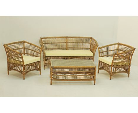 A Rattan garden suite comprising a two-seater sofa, two armchairs and a rectangular coffee table with glass top, the sofa mea