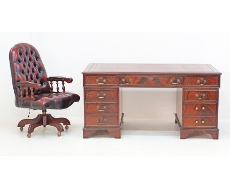 A flame mahogany twin pedestal partners desk, the leather-inset top fitted with three drawers, above two pedestals with three