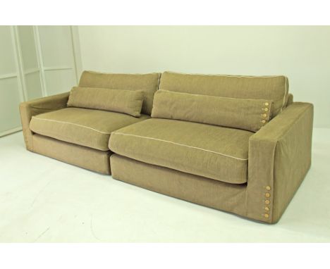 Roche Bobois - A pair of two seater modular couches upholstered in grey with white piping and button details on loose cushion