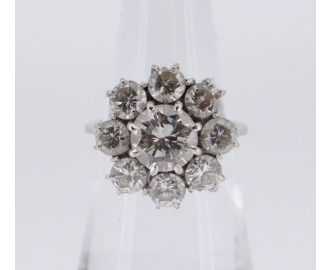 WHITE METAL NINE-STONE DIAMOND CLUSTER RING, the central stone (1.0ct approx.) surrounded by eight further diamonds (0.15ct a