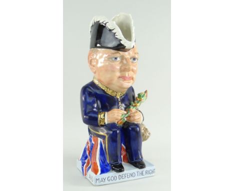 A WILKINSON 'WINSTON CHURCHILL' CHARACTER TOBY JUG BY CLARICE CLIFF, CIRCA 1941, modelled holding cigar and camouflaged battl