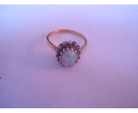 An 18ct opal and diamond cluster ring. 