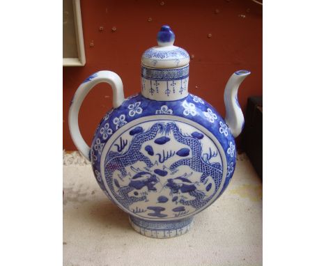 A Chinese blue and white moon flask with lid. 