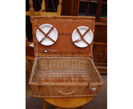 A hamper including four plates. 