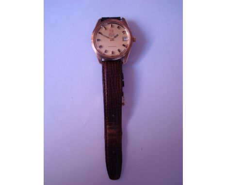 A Gentlemans gilt metal cased Omega Electronic F 300 Hz chronometer, the gold face with baton hour markers and calendar apert