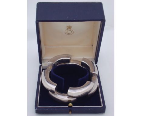 A boxed Georg Jensen bangle, fully marked and with 925 s Denmark, 222 (indistinct designers mark). 