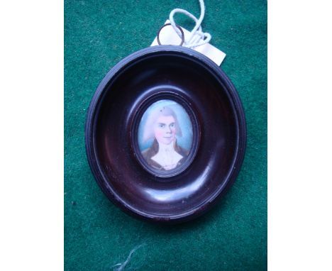 18th Century British School.  A portrait miniature of Dr McCann, watercolour on ivory, in moulded oval wooden frame. 