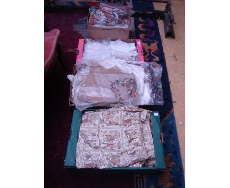 A large quantity of linen and other textiles to include a damask tablecloth, other tablecloths, place mats, napkins, runners,