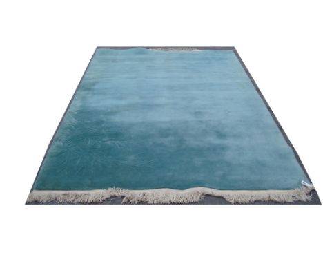 A Chinese Duck Egg blue wool carpet, with raised relief bamboo design. 