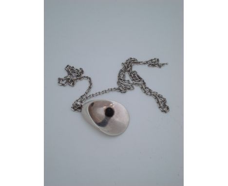 A Georg Jensen pendant designed by Nanna & Jorgen Ditzel, oyster and pearl design, fully marked number 328, 925 s Denmark, in