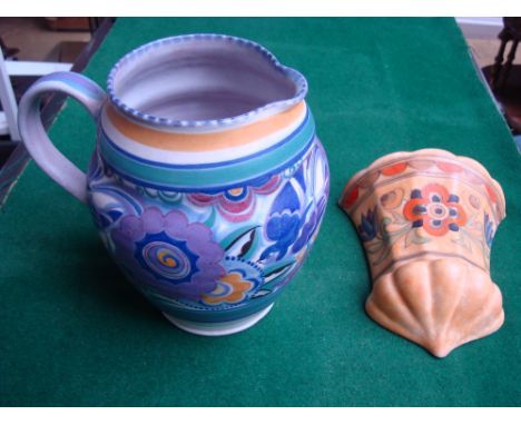 A Crown Ducal Charlotte Rhead wall pocket, printed mark signed C Rhead H 6189 together with a 1930's Poole pottery jug (2). 
