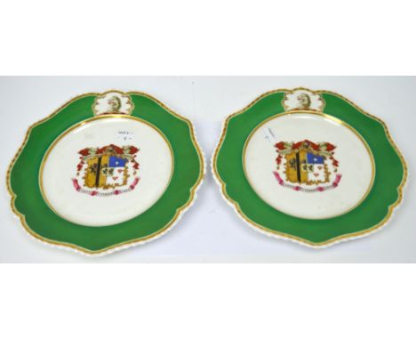 A pair of early 19th century Chamberlain Worcester armorial plates, English lion above armorial decoration to centre within a