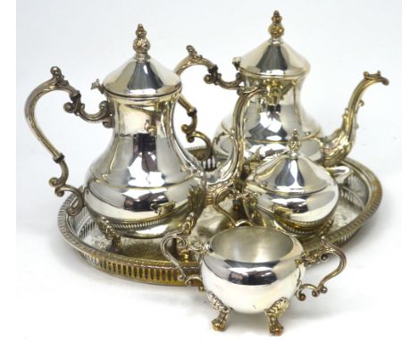 An F E Rogers four-piece silver-plated tea service including teapot, hot water pot, milk jug and sugar bowl and a plated tray