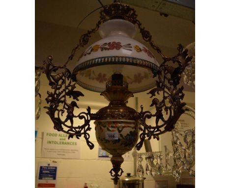 A pair of ornate brass and ceramic floral-decorated lantern-style ceiling light fittings, length approx 60cm.