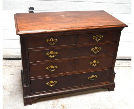 An early 19th century mahogany small chest of drawers, two short drawers over three graduated long drawers flanked by column 