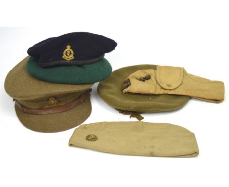 Six military caps to include a WWII desert Italian cap, an American WWII service cap and three WWII berets, one with a US Med