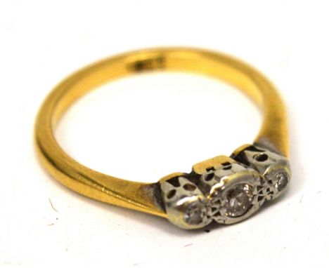 An 18ct yellow gold three-diamond ring with rub-over setting, size K, approx 2.5g.