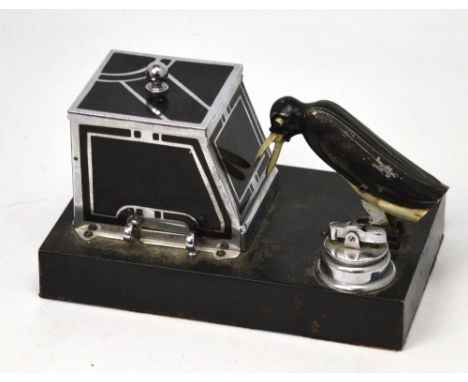An Art Deco Ronson New Yorker Penguin 'Pick-A-Cig' lighter, 14 x 20.5cm.   CONDITION REPORT  In worn condition with paint fla