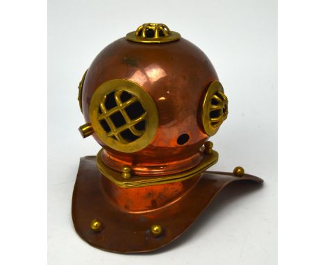 A copper and brass model of a diver's helmet.