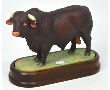 Royal Worcester; a figure of a 'Santa Gertrudis Bull' modelled by Doris Lindner 1961, on fitted wooden plinth, height 21cm.