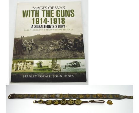A WWI horse's cinch belt with the badge collection of Lieutenant Harold Cooper Bebington from Wallasey who was in the Liverpo