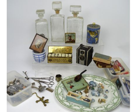 A mixed lot of collectors' items including souvenir spoons, Wade Whimsies, three decanters, dominoes, playing cards etc.