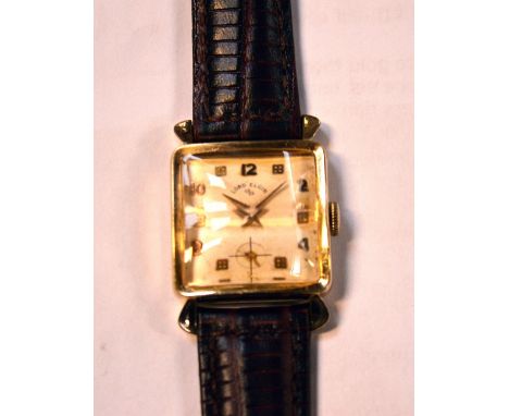 A c1940s gentlemen's Lord Elgin Art Deco tank-style wristwatch, 14ct yellow gold-filled case with faceted crystal, cream sati